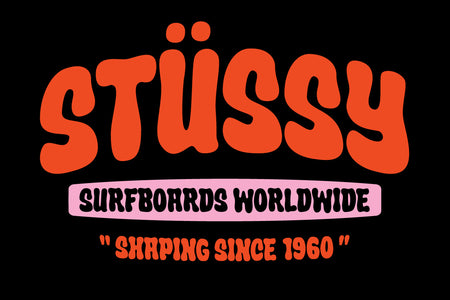 Stüssy Surfboards Worldwide badge in red Crumber organic bubble lettering