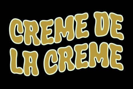 Creme de la Creme in wavy gold Crumber bubble lettering on black